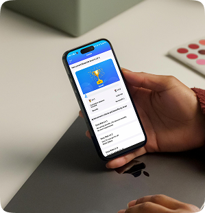 Rider holding a phone showing a trophy reward screen with points earned from a ride
